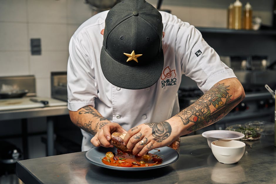 Chef preparing a gourmet dish for an event